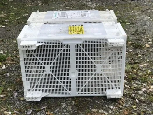 A ventilated package shipping crate ready for queens and bees
