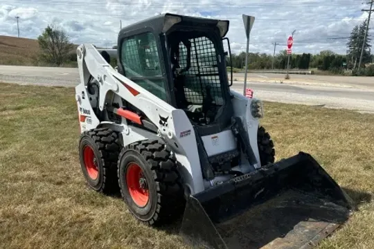 The ranch skid loader used for moving pallets of hives